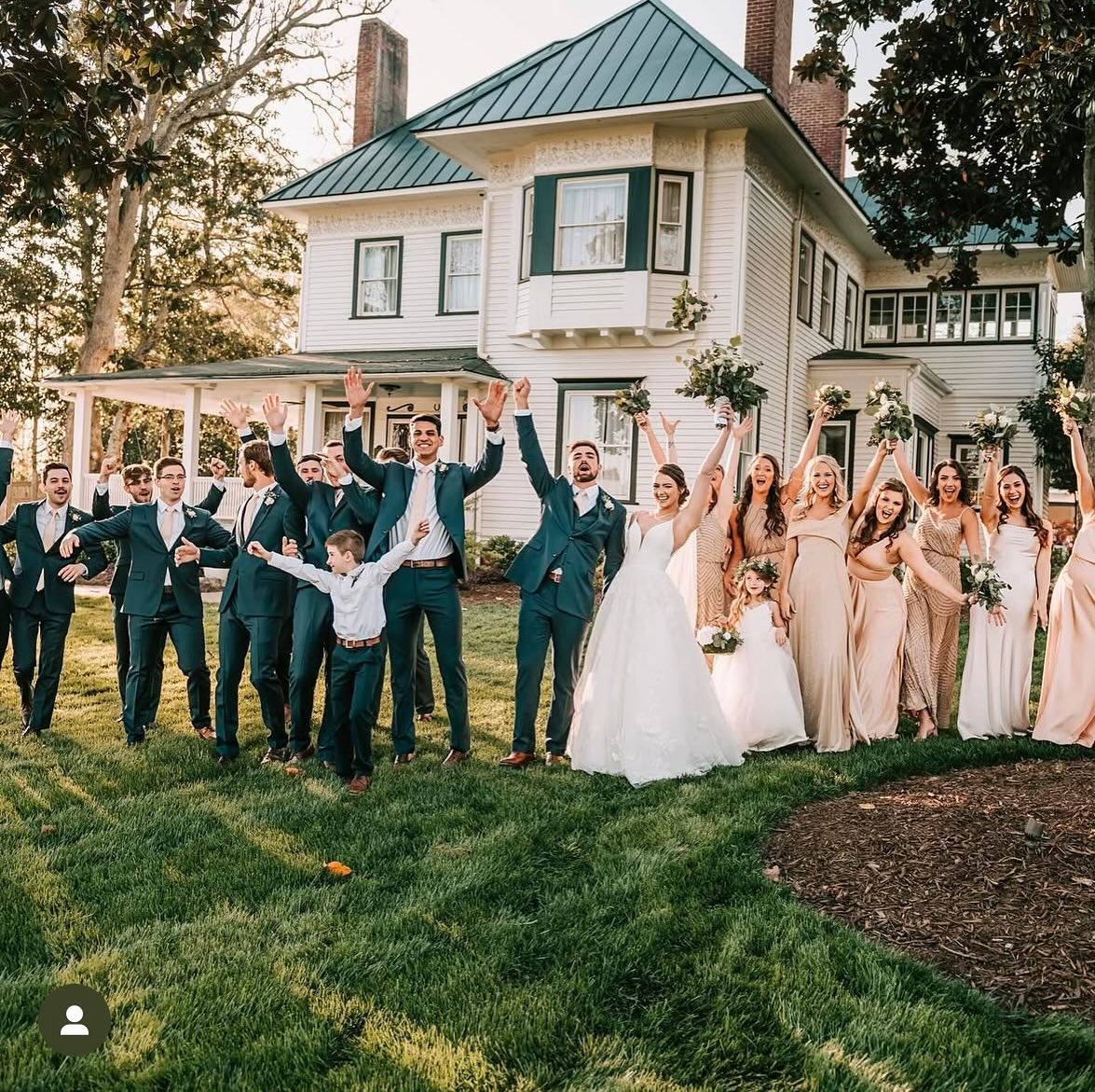 wedding party in front of historic venue