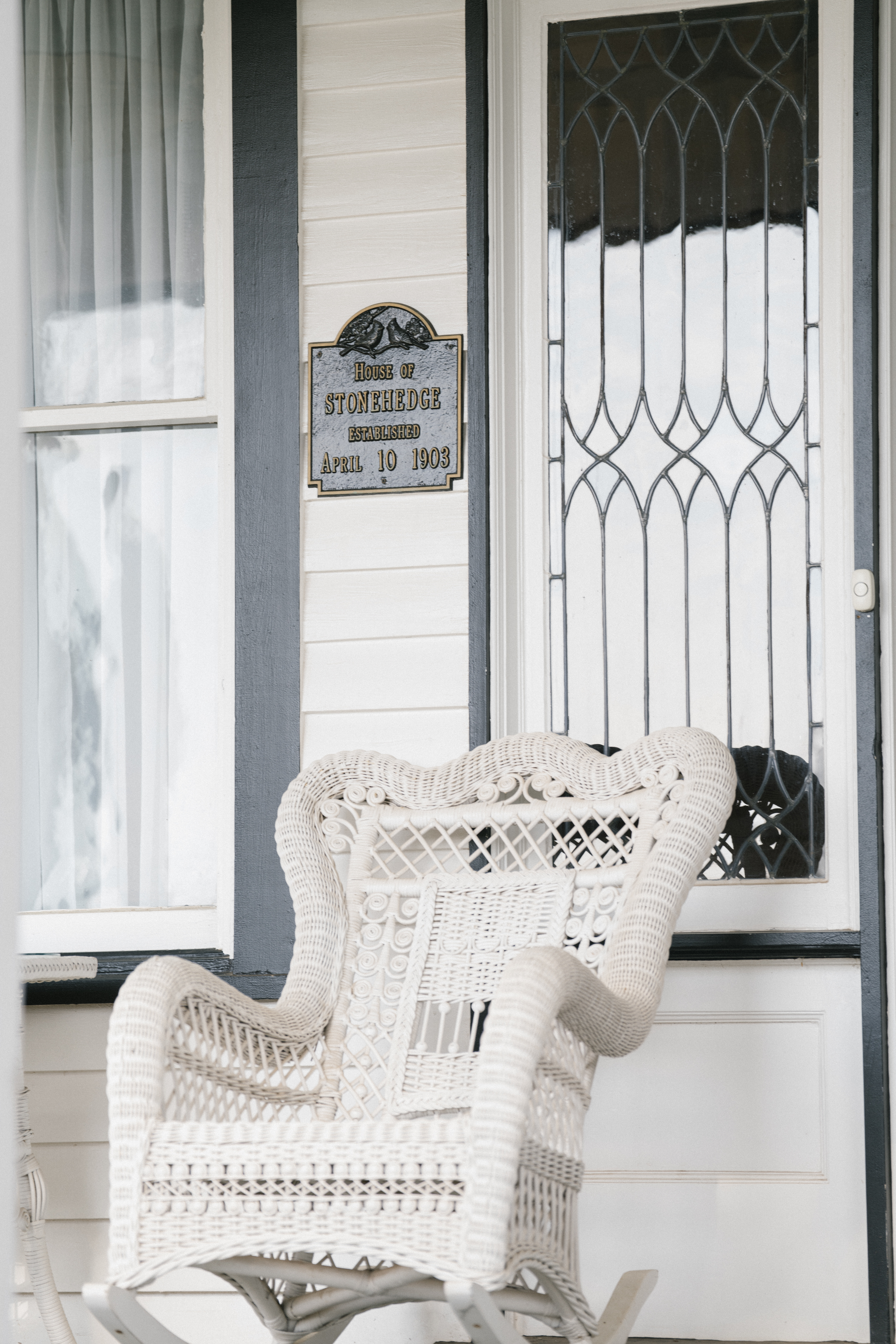wicker chair on front porch
